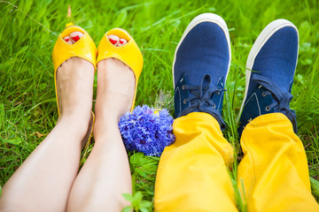 two pair of legs on grass