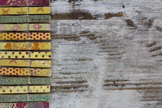 Handmade clothespins in a wood background