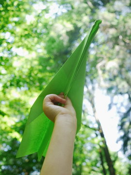 Child Hand With Paper Plane