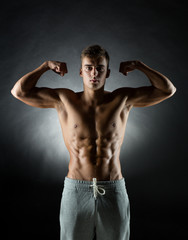 young man showing biceps