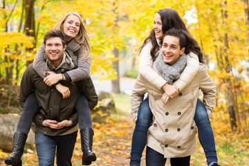 smiling friends having fun in autumn park