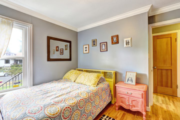 Simple bedroom with light blue walls