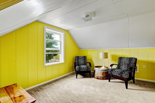 Bright yellow room with sitting area