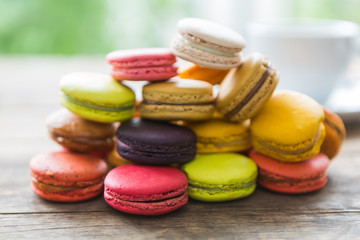 French colorful macarons on wood table