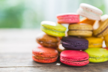 French colorful macarons on wood table