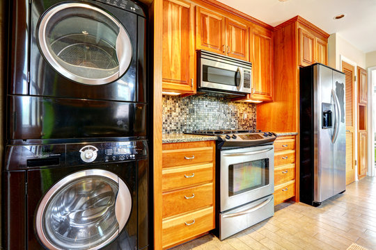 Kitchen room with laundry appliances