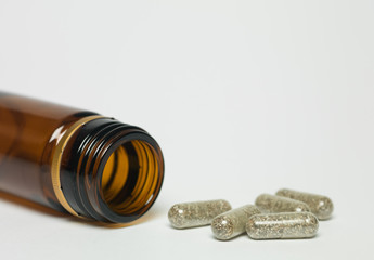 herbal pills with empty bottle