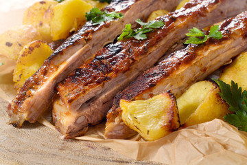 Beef ribs and baked potatoes