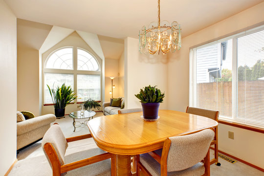 Bright dining area with maple table in luxury house
