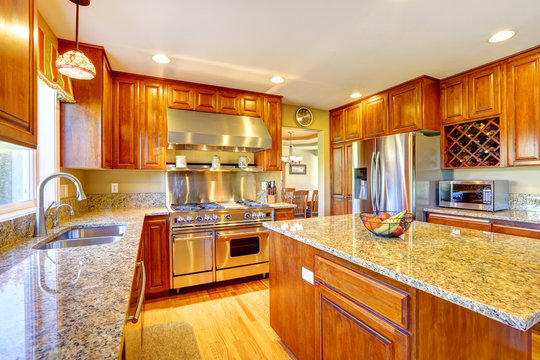 Shiny luxury kitchen room with island
