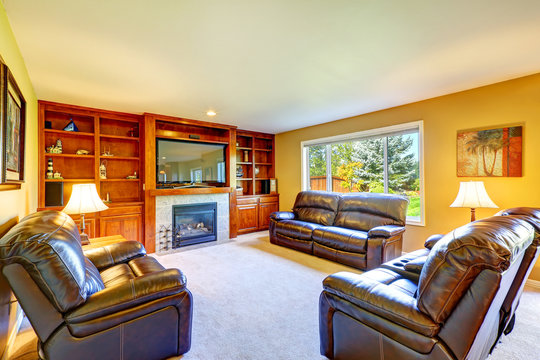 Family room with rich leather furniture set