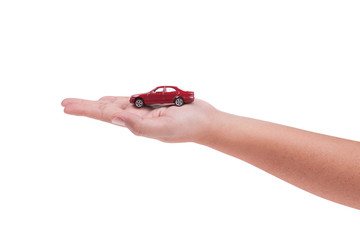 Red model car on hand isolated on white background