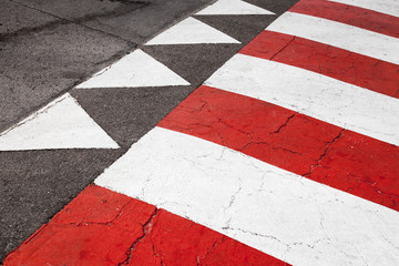 Pedestrian crossing road marking, red white lines and triangles