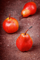 Ripe pears on the made old surface