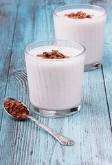 Milkshake with chocolate in glass cups