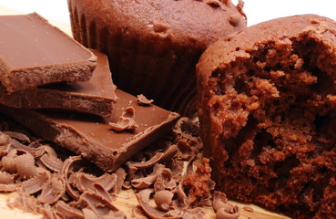 Fresh baked muffins, grated and portion of chocolate