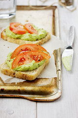 Avocado cream with toasts and tomatoes