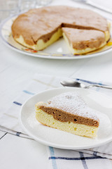 Pie with icing sugar on a white plate