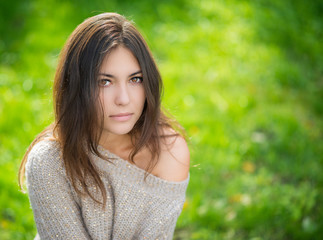 Portrait of young beautiful woman in sweater.