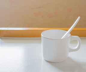 soft focus image of white cup
