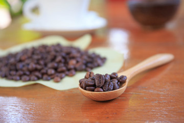 coffee beans on wood spoon