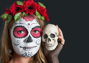 Girl with Calavera Mexicana makeup mask. Helloween