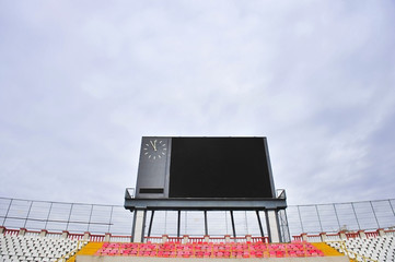 Naklejka premium Football scoreboard and empty tribune