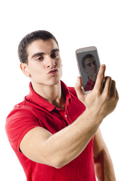 Isolated young man making selfie portrait with hot lips