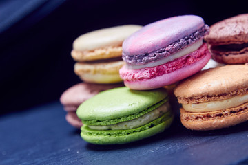Luxury macaroons on black slate, front view