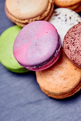 Top view macaroons on black slate