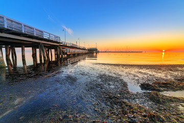 Obraz na płótnie Canvas Sunrise at wooden pier in Sopot over Baltic sea, Poland