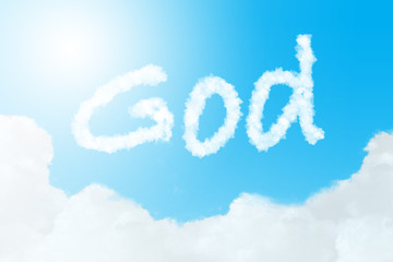 Naklejka na ściany i meble God text in clouds form with blue sky background