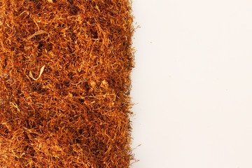 Pile of tobacco on white,with place for simple text