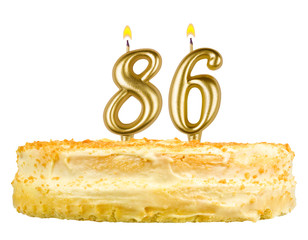 birthday cake with candles number eighty six isolated on white
