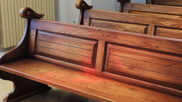 wooden benches in Ukrainian church, panorama from left to right