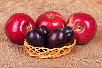 Three red apples and four plums
