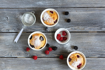 Obraz na płótnie Canvas cupcakes with summer berries, top view