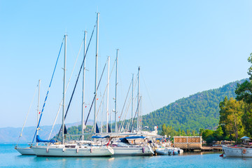 Fototapeta na wymiar sailing yachts parked with deflated sails