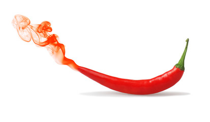 Red chilli pepper with a red smoke, isolated on white