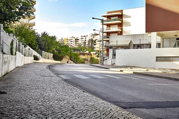 Foto op Canvas Empty street road in city with buildings © artemiykas