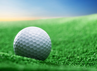 Close up of golf ball on green tee
