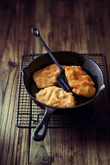 Wiener Schnitzel on a cast iron pan