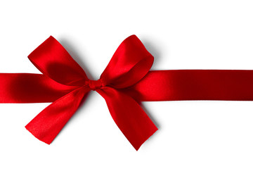 Shiny red satin ribbon on white background