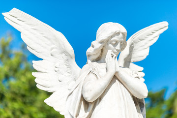 Beautiful angel on a clear blue sky