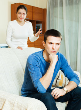 Unhappy man with aggressive wife