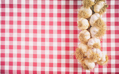 Garlic on a red and white background