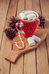 Hot chocolate and marshmallows in red polka dots cup