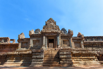 The ancient ruins of a historic Khmer temple in the temple compl