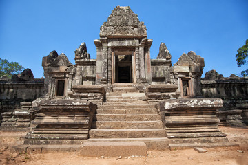 The ancient ruins of a historic Khmer temple in the temple compl