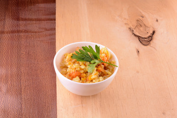 Chinese cuisine - fried rice with meat on wooden background